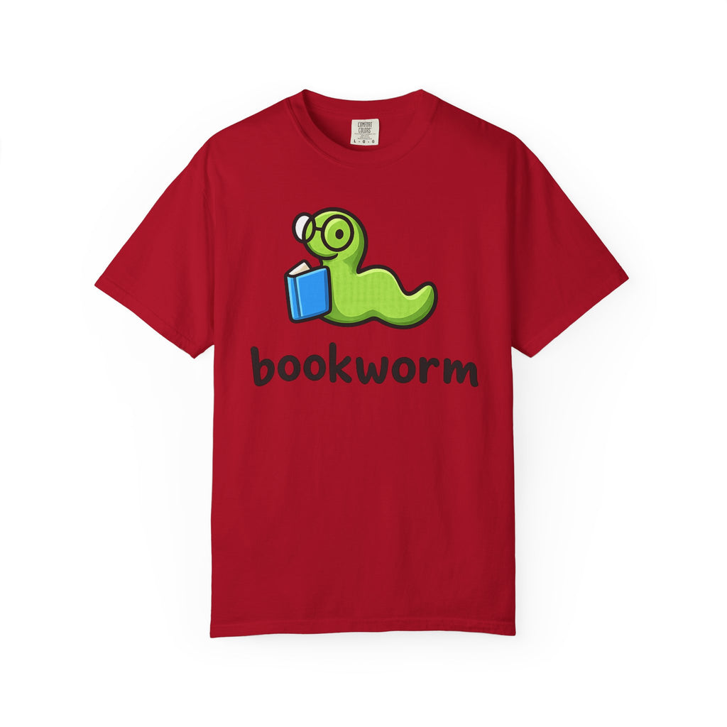 Cute bookworm graphic t-shirt with green worm wearing glasses reading a blue book, printed on periwinkle Comfort Colors garment-dyed cotton unisex tee for book lovers