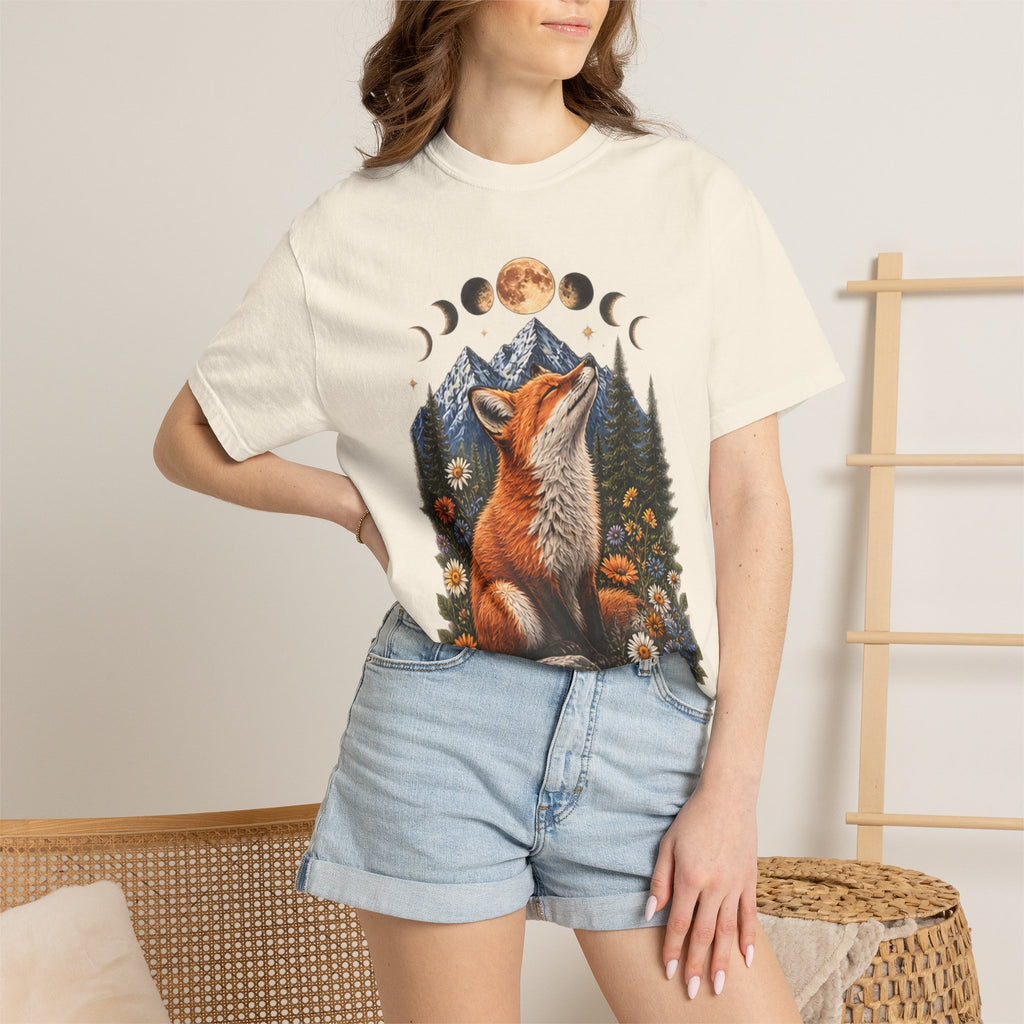 Mystical fox gazing at moon phases amid mountains & wildflowers. Vintage boho graphic tee for nature & celestial lovers. Order today!