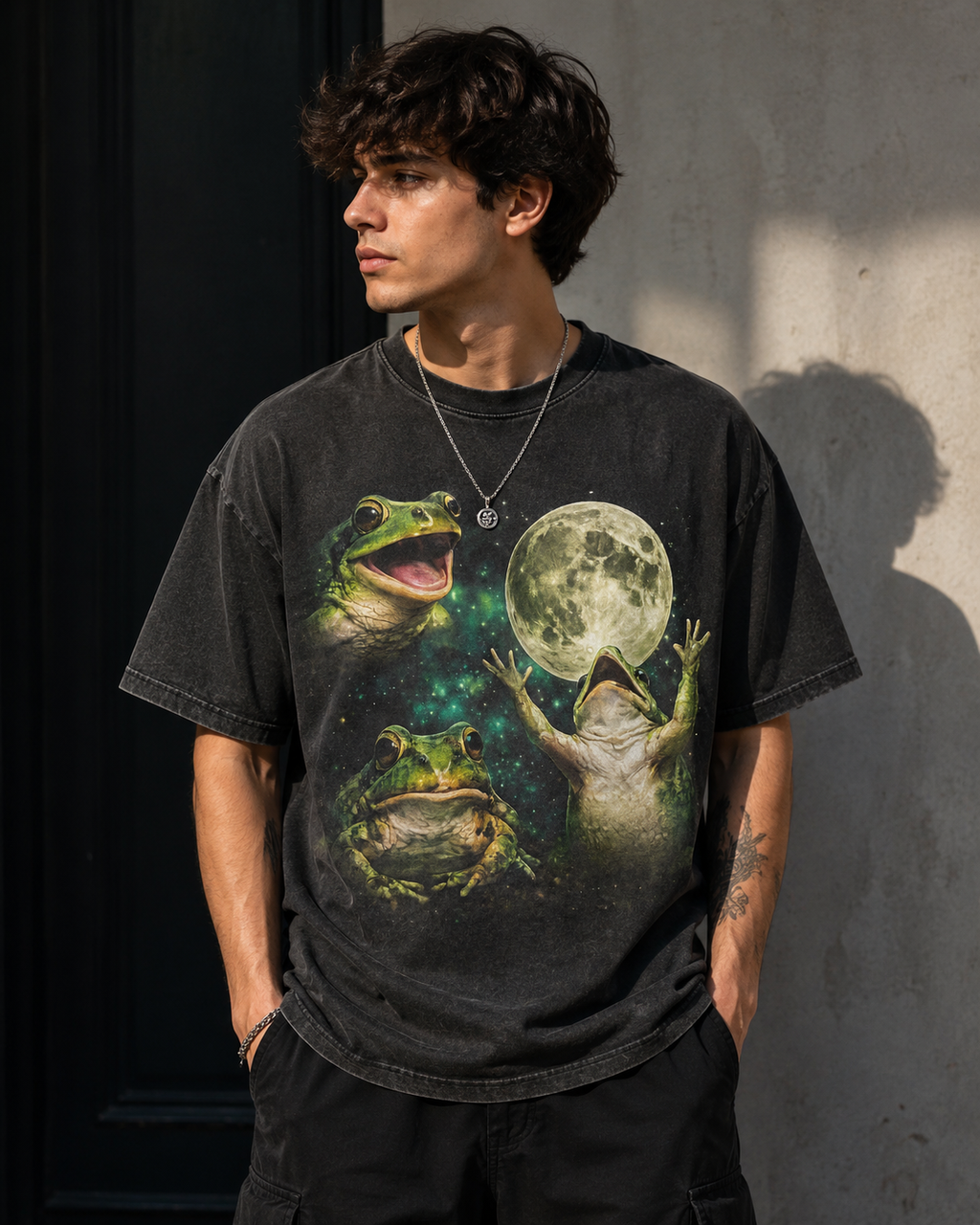 funny frog shirt, three wolf moon parody, frog lover gift, cottagecore shirt, goblincore tee, vintage graphic tee, oversized streetwear, cosmic frog shirt, meme shirt, funny vintage tee, frogcore, unisex graphic tee Man wearing oversized washed black t-shirt with three photorealistic frogs howling at a full moon against a cosmic green nebula, vintage parody graphic tee